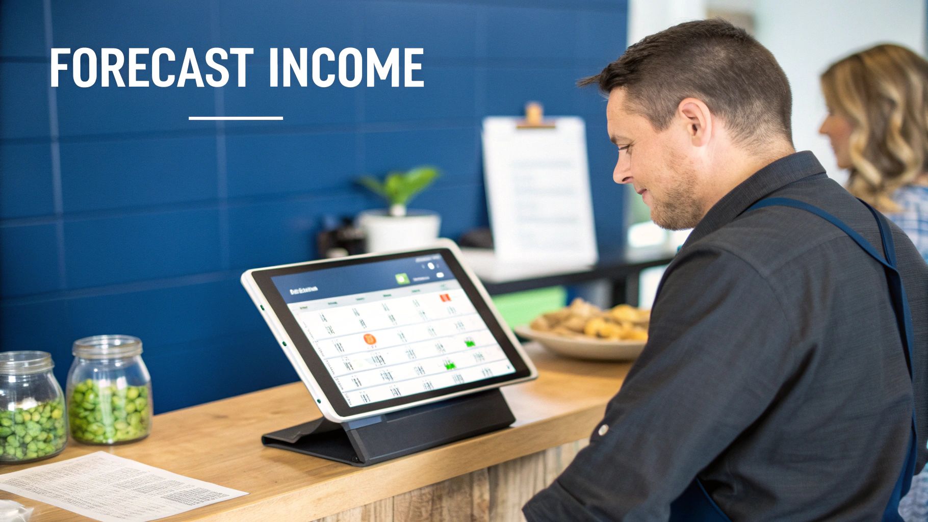 A close-up of a person's hands entering numbers into a calculator on a desk with financial documents.